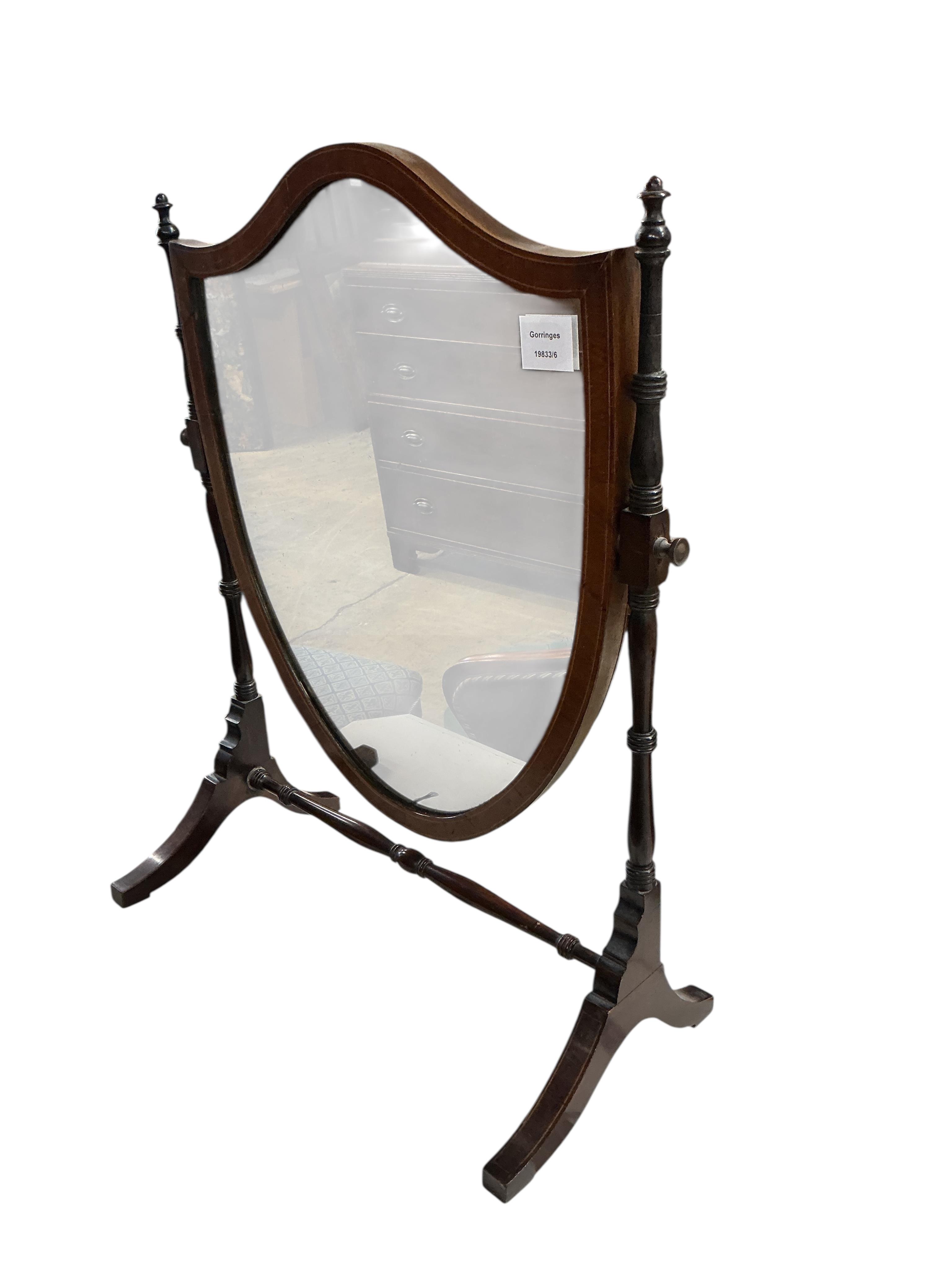 An Edwardian mahogany toilet mirror with shield shaped plate, width 52cm, height 66cm
